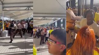 Security fights off soccer fans breaking into stadium