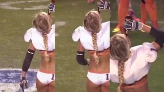 Female football player chugs beer on field