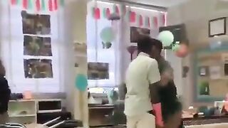 Teacher jumps in, physically breaks up fight instead of standing by watching