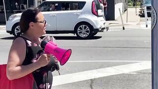 Woman with megaphone gets EGGED by a teenager in public