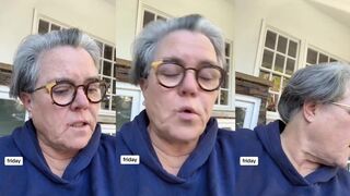 Rosie O'Donnell throws nuts to some squirrels